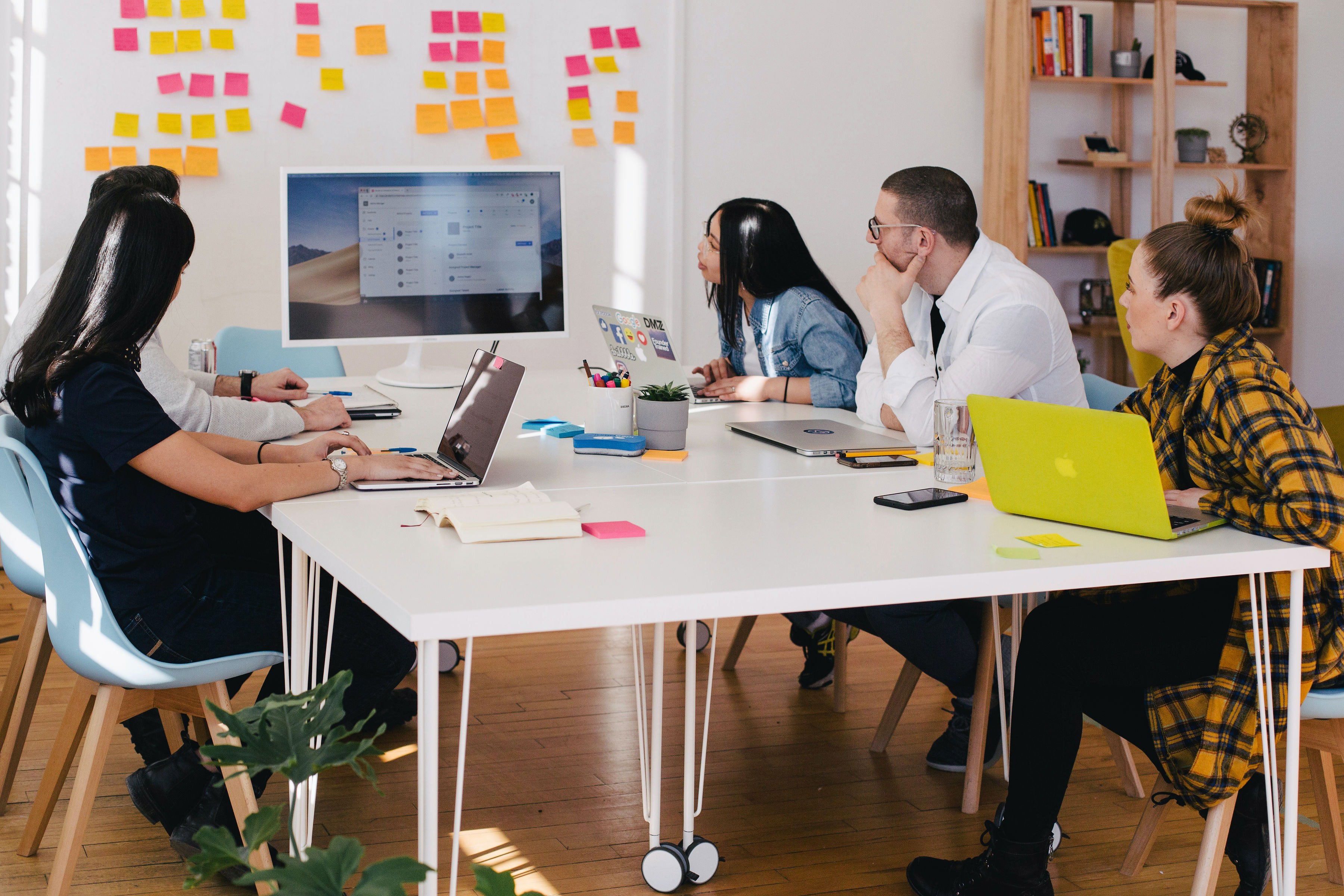 Group of people using post-it notes and planning
