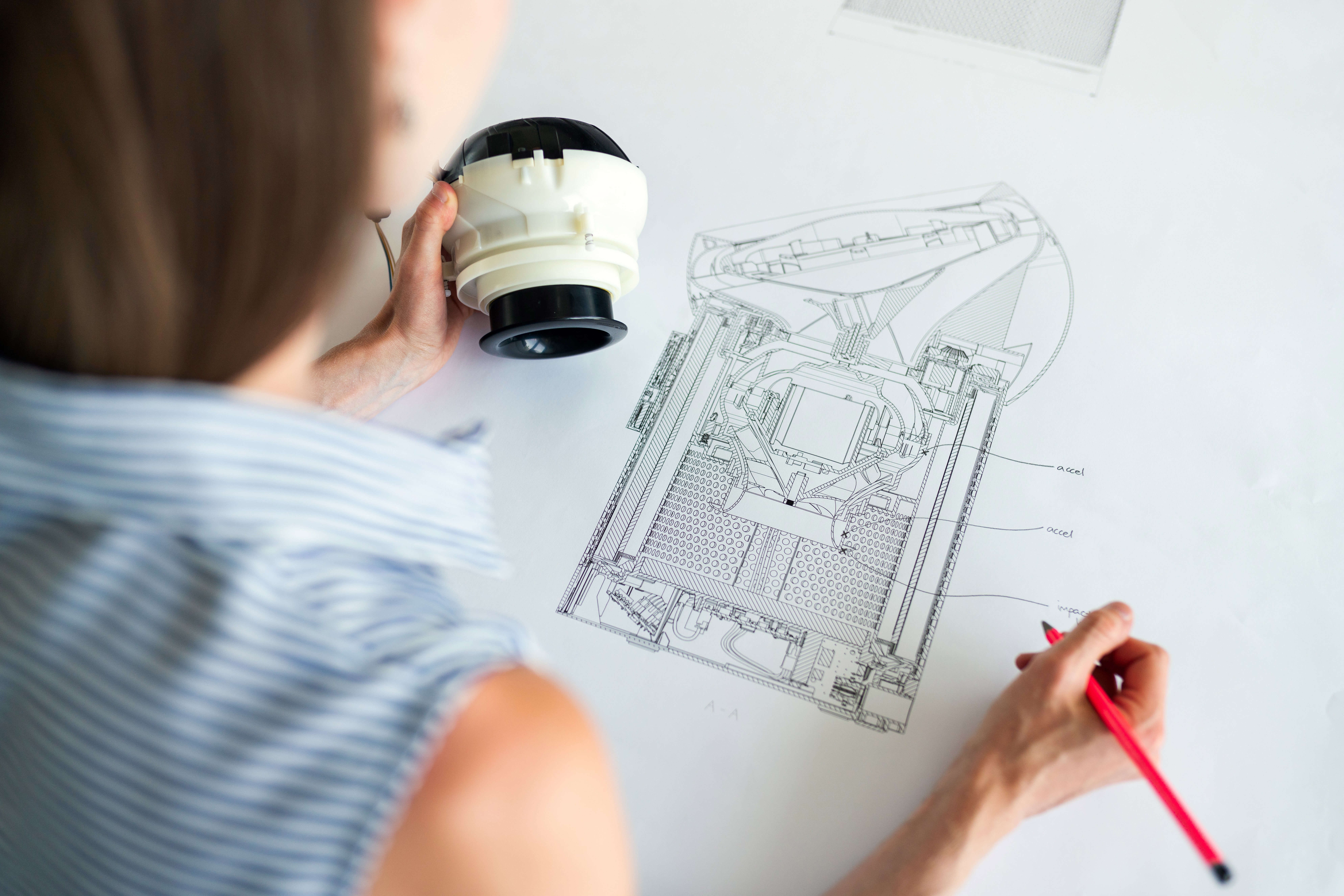 A person makes a product drawing.